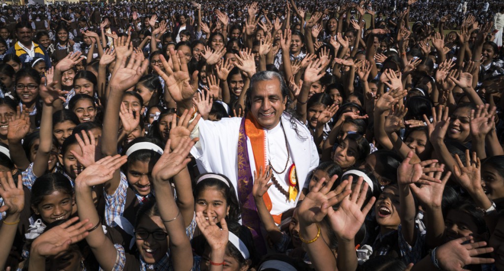 Guruji swamped by adoring Indian kids after their successful completion of the Sun Salutation world record. 